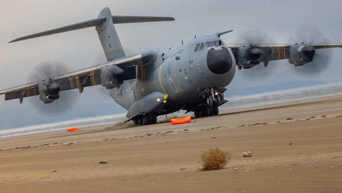 See SWNS story SWNAbeach. How's this for a day at the beach? Huge military transport planes have been spotted landing on Pembrey Sands in West Wales. The RAF Atlas A400Ms have been carrying out beach landing training at the coastal spot this week. They also practiced the insertion of so-called pathfinders, specialised soldiers dropped into place in order to set up and operate drop zones. Incredible pictures show the crews of the Brize Norton-based LXX and 30 Squadrons carrying out the objectives.