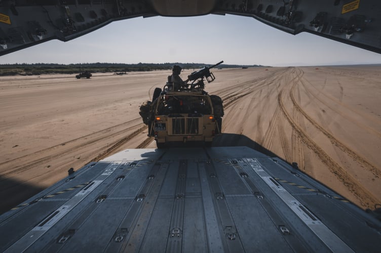 See SWNS story SWNAbeach. How's this for a day at the beach? Huge military transport planes have been spotted landing on Pembrey Sands in West Wales. The RAF Atlas A400Ms have been carrying out beach landing training at the coastal spot this week. They also practiced the insertion of so-called pathfinders, specialised soldiers dropped into place in order to set up and operate drop zones. Incredible pictures show the crews of the Brize Norton-based LXX and 30 Squadrons carrying out the objectives.