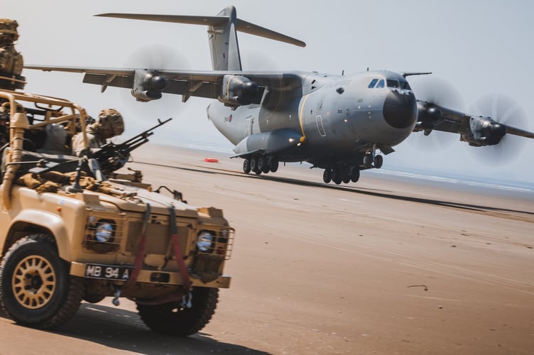 See SWNS story SWNAbeach. How's this for a day at the beach? Huge military transport planes have been spotted landing on Pembrey Sands in West Wales. The RAF Atlas A400Ms have been carrying out beach landing training at the coastal spot this week. They also practiced the insertion of so-called pathfinders, specialised soldiers dropped into place in order to set up and operate drop zones. Incredible pictures show the crews of the Brize Norton-based LXX and 30 Squadrons carrying out the objectives.