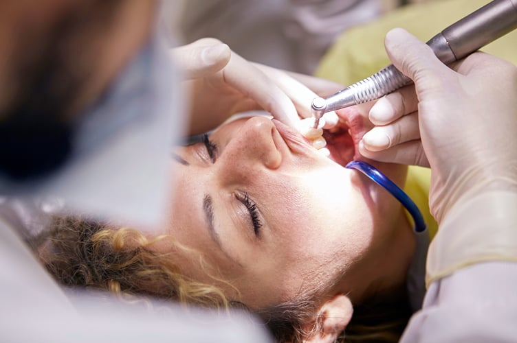 Dentist working on patient